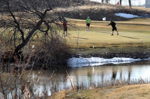 Golfers take full advantage of the incredible weather and take in a round of golf at John Blumberg Golf Course Saturday afternoon during their earliest opening season ever. March 17 2012 (Ruth Bonneville/Winnipeg Free Press)