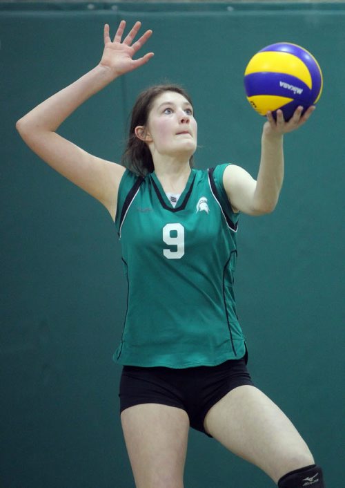 Brandon Sun 17032012 Alison Quiring of the Storm Spartans serves during the Storm/Vikings 16-and-under girls club volleyball tournament at Neelin High School on Saturday afternoon. (Tim Smith/Brandon Sun)