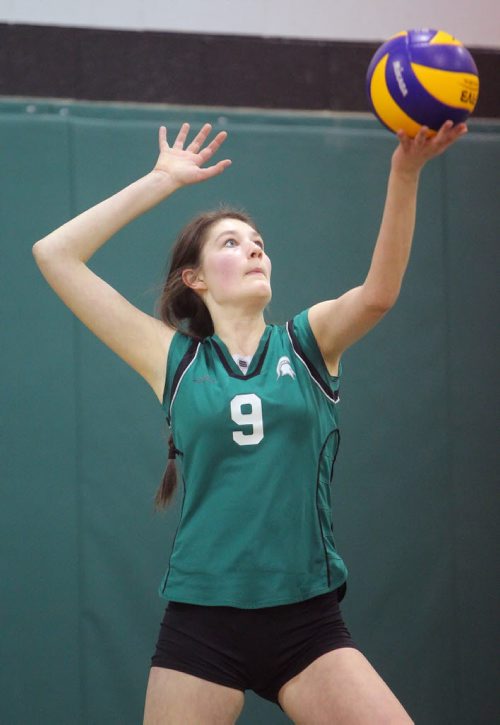 Brandon Sun 17032012 Alison Quiring of the Storm Spartans serves during the Storm/Vikings 16-and-under girls club volleyball tournament at Neelin High School on Saturday afternoon. (Tim Smith/Brandon Sun)
