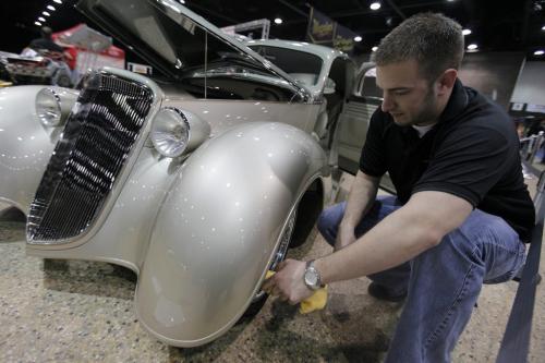 ***(Sorry lost paper I wrote his name on... should be in Mary Agnes story talking about North Dakota car.)***   March 17, 2012 - 120318  -   polishes a car at the World of Wheels at the Convention Centre Sunday March 18, 2012.    John Woods / Winnipeg Free Press