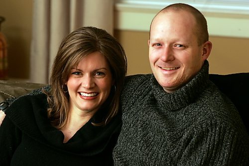 BORIS MINKEVICH / WINNIPEG FREE PRESS  070130 Tyler Pelke and his wife Jen pose for a photo in his home on Craig Street.