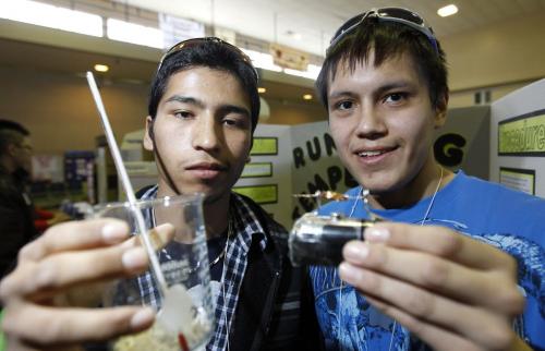 Joshua Mousseau, 18, and Dakota Roulette, 17, from Isaac Beaulieu Memorial School in Sandy Bay show off some items from their entry into the 10th annual First Nations Science Fair at the Notre Dame Campus of Red River College, Wednesday March 21, 2012. Their judge said the project was very good, and liked how most of their effort went into the data, and not into trying to make a flashy display. The project was about heat generated from a running electric motor. (TREVOR HAGAN/WINNIPEG FREE PRESS)