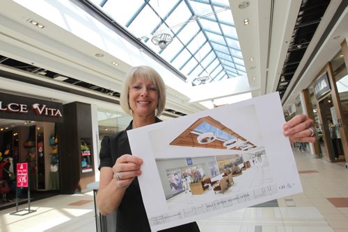 The St. Vital hopping centre is getting a $10-million interior facelift between now and November. Renovations will include all new flooring, lighting and furniture throughout the mall as well as a couple of new skylights. A shot of general manager CHERYL MAZUR holding some drawings in the mall.  March 21, 2012  BORIS MINKEVICH / WINNIPEG FREE PRESS