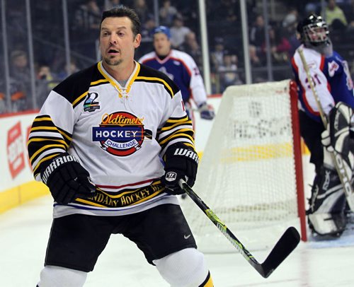 "Old Timer" Theo Fleury in action Thursday night against the City cops.......See story. March 22, 2012 - (Phil Hossack / Winnipeg Free Press)