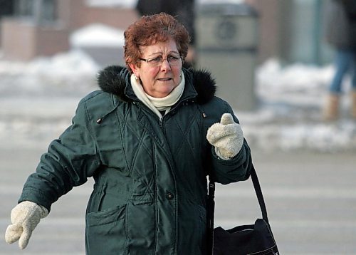 BORIS MINKEVICH / WINNIPEG FREE PRESS  070131 Cold people in downtown Winnipeg by the Bay. NO ID on her. She ran on to a bus before I could catch her.