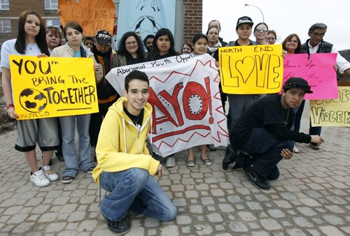 Michael Champagne, 24, front, left, leads the rally against violence in the community at the bell tower on Selkirk, Friday, March 23, 2012. (TREVOR HAGAN/WINNIPEG FREE PRESS)