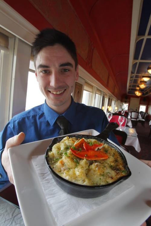 75th year anniversary of the invention of Kraft dinner story by Dave Sanderson. Resto Gare on Des Meurons Road serves mac and cheese and lobster. Curtis Love poses with the fancy noodle dish. March 23, 2012  BORIS MINKEVICH / WINNIPEG FREE PRESS