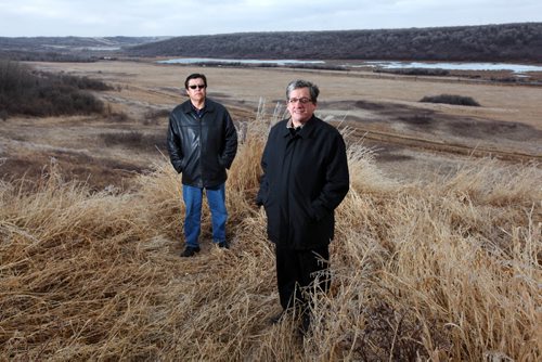 Brandon Sun 24032012 Councillor Heath Bunn and Chief Ken Chalmers of the Birdtail Sioux Dakota First Nation stand overlooking the valley where the CN railway line runs through the aboriginal community. The band council has plans to build a railway spur on the railway line as part of an economic partnership. (Tim Smith/Brandon Sun)