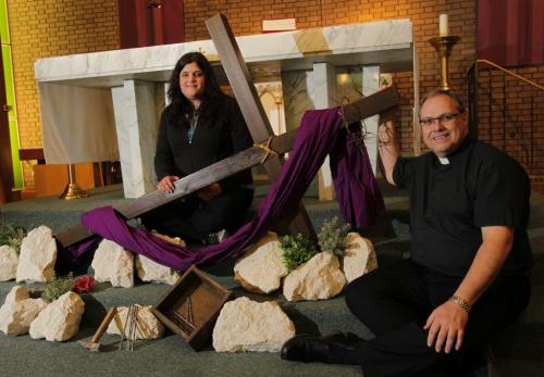 Roman Catholics celebrate 25 years of Public Way of the Cross on Good Friday. Nicole Hoard, pastoral assistant and organizer of event, and Father Barry Schoonbaert pose for a photo with the cross that will be used in the event. Photo taken at St. Vital Roman Catholic Parish, 1629 Pembina Hwy. March 27, 2012  BORIS MINKEVICH / WINNIPEG FREE PRESS