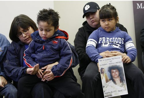 The family of murder victim Belinda McKay Mar.9 spoke out about victims rights  at an assembly of Manitoba Chief offices on Portage Ave Friday morning ,in pic Bernice McKay ( sister of victim)  holding victims son  Wallace  age 5 , he has autism and epilepsy , with his sister,(daughter of victim ) Avril McKay  age 7  holder her mothers picture , she is held by her uncle Anthony McKay  KEN GIGLIOTTI  / WINNIPEG FREE PRESS  / MARCH 30 2012