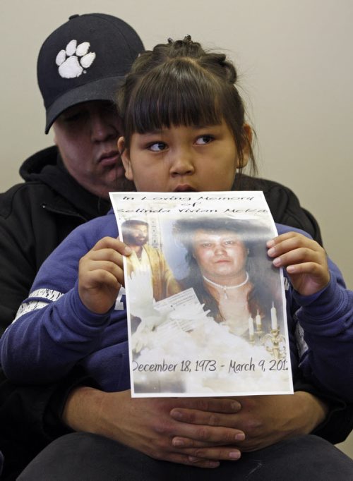 The family of murder victim Belinda McKay Mar.9 spoke out about victims rights  at an assembly of Manitoba Chief offices on Portage Ave Friday morning ,in pic  Belinda's daughter (daughter of victim ) Avril McKay  age 7  holder her mothers picture , she is held by her uncle Anthony McKay  KEN GIGLIOTTI  / WINNIPEG FREE PRESS  / MARCH 29 2012