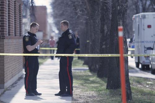 March 31, 2012 - 120331  -  Winnipeg police investigate at a suspicious scene at the back of the 700 block of Notre Dame Avenue at Toronto Street Saturday March 31, 2012.    John Woods / Winnipeg Free Press