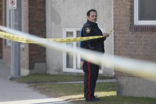 March 31, 2012 - 120331  -  Winnipeg police investigate at a suspicious scene at the back of the 700 block of Notre Dame Avenue at Toronto Street Saturday March 31, 2012.    John Woods / Winnipeg Free Press