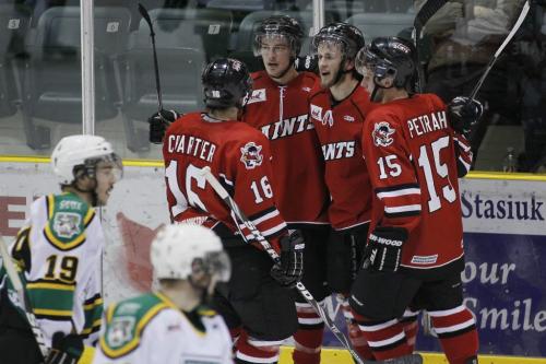 April 1, 2012 - 120401  -  Winnipeg Saints' Paul Crane (24) (2nd from R)celebrates his goal against the Portage Terriers in game one of the MJHL Turnbull Cup in Portage La  Prairie Sunday April 1, 2012.  John Woods / Winnipeg Free Press