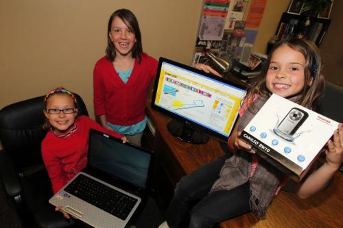 L-R Emma Kasian(sitting with glasses), Keirra Nemetchek(tall on left), and Haley Gosselin(right sitting on desk) pose for a photo with a laptop and portable video cameras they won.  From Website http://www.exploravision.org Region 4 Title: The Fascinating Toothbrush Sensor School: Springs Christian Academy  Winnipeg, MB Coach: Susan MacLeod Students: Haley Gosselin, Emma Kasian, Keirra Nemetchek Since its inception in 1992, more than 287,000 students from across the United States and Canada have participated in the ExploraVision program. It's a fun and engaging project that can inspire a lifelong love of science for students and teachers alike.  WHAT IS EXPLORAVISION?  ExploraVision is a science competition that encourages teachers to make science a part of their curriculum. As a teacher sponsor, you will lead your students as they work in groups of 2  4 to simulate real research and development. You will guide your students as they study a technology of interest and predict what that technology might be like 20 years from now. Teams will explore what is necessary to make their visions a reality. Past winners have envisioned technologies ranging from a self-cleaning toilet to a new method of treating diabetes.  WHO CAN PARTICIPATE?  ExploraVision is designed for K  12 students of all interest, skill and ability levels. The competition is open to students enrolled in public, private or home school in the United States and Canada. Click here to see the full eligibility requirements.  HOW DO I GET MY STUDENTS INVOLVED?  The most important step is educating them about the project. You can then either implement it as part of your curriculum or become a coach for the students who would like to participate. But if they don't know about it they'll never know if they want to register.  WHY DOES TOSHIBA SPONSOR EXPLORAVISION?  Toshiba was founded with a strong commitment to technological innovation, and this commitment goes hand in hand with the company's passion for science education. Through Toshiba's shared mission partnership with NSTA (National Science Teachers Association), the Toshiba/NSTA ExploraVision competition makes a vital contribution to the educational community. EVA is one of the world's largest K-12 science competitions and is a cornerstone of Toshiba's efforts to inspire youth in the fields of science, technology, engineering and math (STEM).  ABOUT NSTA  The National Science Teachers Association, founded in 1944 and headquartered in Arlington, Virginia, is the largest organization in the world committed to promoting excellence and innovation in science teaching and learning for all. NSTA's current membership of 60,000 includes science teachers, science supervisors, administrators, scientists, business and industry representatives, and others involved in and committed to science education. April 2, 2012  BORIS MINKEVICH / WINNIPEG FREE PRESS