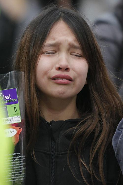 April 2, 2012 - 120402  -  A young girl weeps as family and friends gather in front of 238 Balmoral Monday at a vigil for Johnathen Felix Monday April 2, 2012.  Felix was shot outside the residence Sunday April 1, 2012 John Woods / Winnipeg Free Press