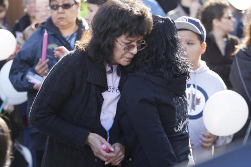 April 3, 2012 - 120403  - The mother of Carolyn Marie Sinclair is comforted at a vigil Tuesday April 3, 2012 for Carolyn Marie Sinclair and her unborn baby who were found murdered and dumped in a backlane on the 700 block of Notre Dame Avenue Saturday March 31, 2012.  John Woods / Winnipeg Free Press