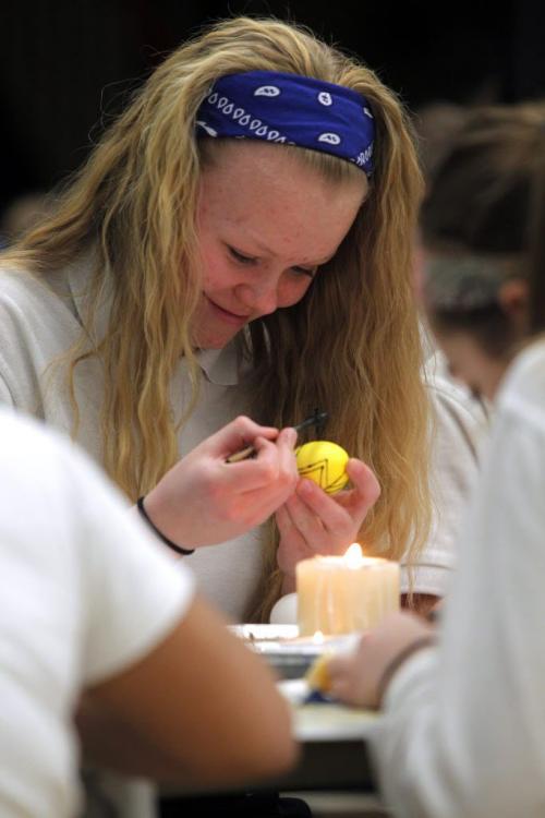 Some kids decorating easter eggs at Immaculate Heart of Mary School, 650 Flora Avenue. Here Maria Lazar,13, works on an egg.  April 4, 2012  BORIS MINKEVICH / WINNIPEG FREE PRESS