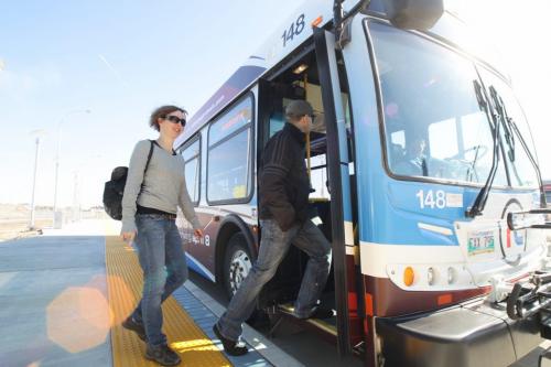 Lori and Daryl Benoit get on a rapid transit bus at the Fort Rouge Station on the new Southwest Transitway which opened today.  120405 April 05, 2012 Mike Deal / Winnipeg Free Press