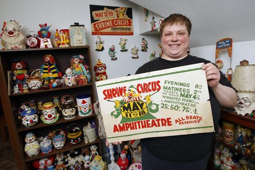 In pic clown cookie jar collector  and curios collector Melody Zakowich  with Shrine Circus bus sign  - David Sanderson story Collectors - KEN GIGLIOTTI  / WINNIPEG FREE PRESS  / April 5 2012