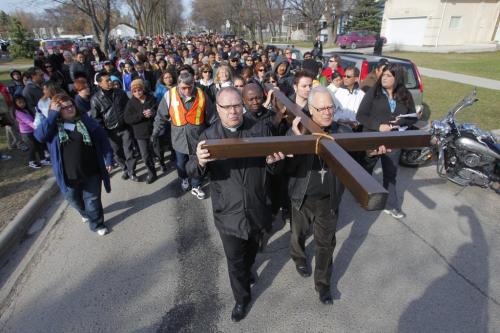 Way of the Cross - St. Vital Roman Catholic Church at 1629 Pembina Hwy. They marched with a cross through the neighbourhood. April 6, 2012  BORIS MINKEVICH / WINNIPEG FREE PRESS