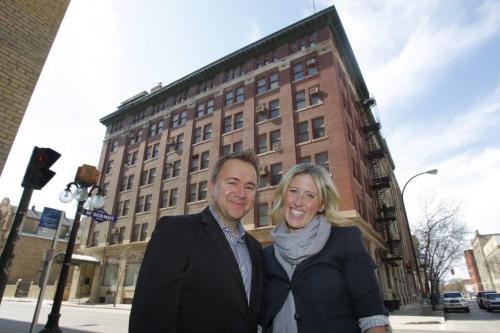 Mark Buleziuk (left) and Shelley Buleziuk pose for a photo with 66 King Street in behind them, a building they are going to develop into commercial. April 6, 2012  BORIS MINKEVICH / WINNIPEG FREE PRESS