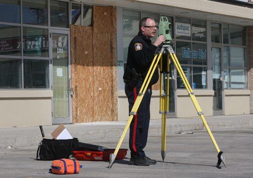 Winnipeg Police were taking GPS measurements at the scene of a Ultracuts on Portage and Cavalier Sunday- On Saturday night a suv crashed through the front window causing serious injuries to two inside- See Melissa Martin story- Apr 08, 2012   (JOE BRYKSA / WINNIPEG FREE PRESS)