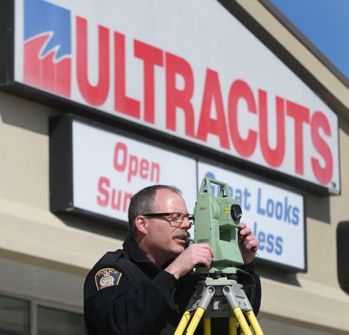 Winnipeg Police were taking GPS measurements at the scene of a Ultracuts on Portage and Cavalier Sunday- On Saturday night a suv crashed through the front window causing serious injuries to two inside- See Melissa Martin story- Apr 08, 2012   (JOE BRYKSA / WINNIPEG FREE PRESS)