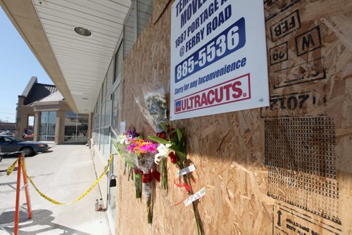 Flowers and notes are taped to the outside wall of the Ultracuts Hair Salon on Portage at Rouge Rd. Wednesday afternoon. See Gabrielle's story. April 11,  2012 (Ruth Bonneville/Winnipeg Free Press) Kendall Wiebe