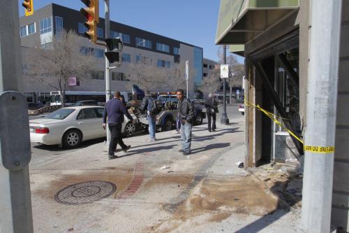 A MVC at the corner of Logan and Main Street. Mitchell Fabrics got nailed by one of the cars (IN BACKGROUND, WHITISH CADDY). 4 sent to hospital according to the WFP web site.  April 11, 2012  BORIS MINKEVICH / WINNIPEG FREE PRESS