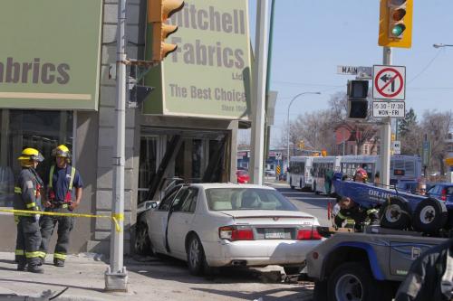 A MVC at the corner of Logan and Main Street. Mitchell Fabrics got nailed by one of the cars. 4 sent to hospital according to the WFP web site.  April 11, 2012  BORIS MINKEVICH / WINNIPEG FREE PRESS