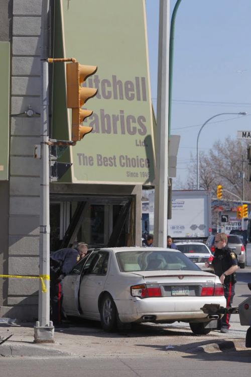 A MVC at the corner of Logan and Main Street. Mitchell Fabrics got nailed by one of the cars. 4 sent to hospital according to the WFP web site.  April 11, 2012  BORIS MINKEVICH / WINNIPEG FREE PRESS