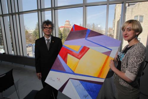 Paul Hess, director of School of Art, with 3rd year fine arts student Jade Troost and the commemorative painting she did help celebrate the grand opening of ARTlab, the new building for the School of Art at the University of Manitoba. VIP's signed it at the press conference. April 12, 2012  BORIS MINKEVICH / WINNIPEG FREE PRESS
