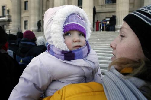 John Woods / Winnipeg Free Press / Februaru 5/07 - 070205  - Victoria Hale-Fairfax and her daughter Madison joined about sixty other protesters at the Legislative grounds to rally against the federal Conservative government's inaction on their child care promises Monday February 5/07.