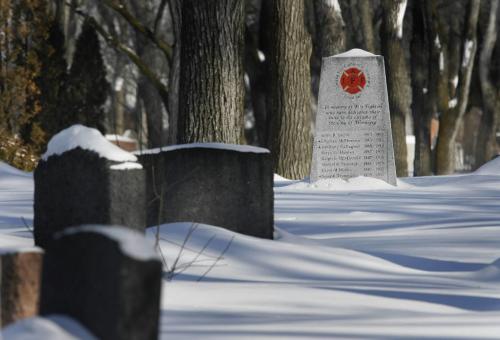 John Woods / Winnipeg Free Press / Februaru 5/07 - 070205  - A memorial dedicated to fallen firefighters at Brookside Cemetery Monday February 5/07.   Two firefighters died in a fire last night.