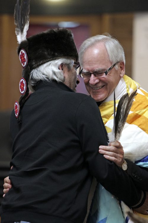 James Weisgerber, the Archbishop of Winnipeg, and Phil Fontaine hug during a ceremony at the Thunderbird House. Anishinaabe elders and community leaders Tobasonakwut Kinew, Fred Kelly, Phil Fontaine and Bert Fontaine adopted James in a traditional "Naabagoondiwin" adoption ceremony.  See Nick Martin story 120414 - Saturday, April 14, 2012 -  (MIKE DEAL / WINNIPEG FREE PRESS)