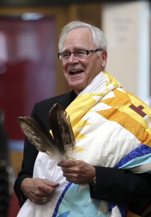 James Weisgerber, the Archbishop of Winnipeg, reacts to a joke made by Wab Kinew who conducted a ceremony at the Thunderbird House. Anishinaabe elders and community leaders Tobasonakwut Kinew, Fred Kelly, Phil Fontaine and Bert Fontaine adopted James in a traditional "Naabagoondiwin" adoption ceremony.  See Nick Martin story 120414 - Saturday, April 14, 2012 -  (MIKE DEAL / WINNIPEG FREE PRESS)