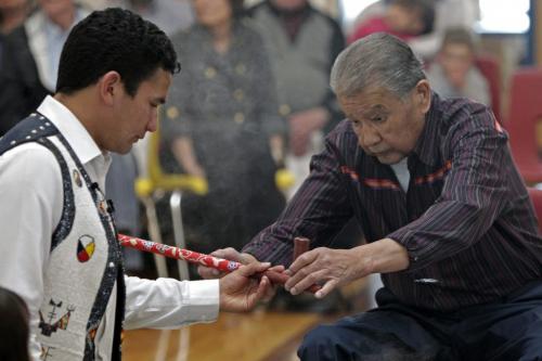 Wab Kinew and his father Tobasonakwut prepair the ceremonial pipe during the adoption at Thunderbird House. Anishinaabe elders and community leaders Tobasonakwut Kinew, Fred Kelly, Phil Fontaine and Bert Fontaine adopted James Weisgerber, the Archbishop of Winnipeg, in a traditional "Naabagoondiwin" adoption ceremony at the Thunderbird House. See Nick Martin story 120414 - Saturday, April 14, 2012 -  (MIKE DEAL / WINNIPEG FREE PRESS)