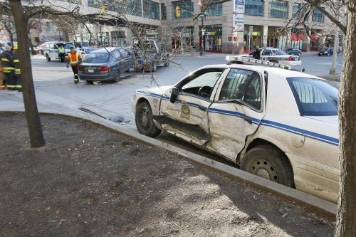 April 16, 2012 - 120416  -  A the intersection of Portage and Carlton on Monday, April 16, 2012 police and emergency personnel were called to the scene of a MVC between a car and a police cruiser.    John Woods / Winnipeg Free Press