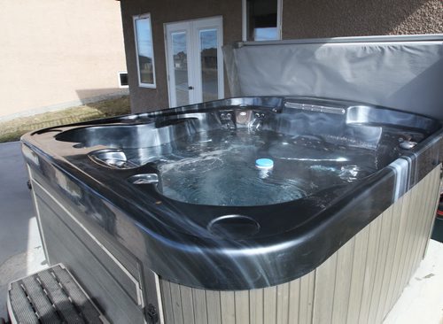 409 St George Place in Niverville, Manitoba-Hot tub on deck- See Todd Lewys story- Apr 16, 2012   (JOE BRYKSA / WINNIPEG FREE PRESS)