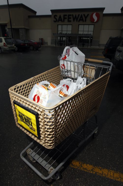 A shopping cart full of groceries at Safeway in Madison Square, Thursday, April 17, 2012. During the budget announcement today, Finance Minister Stan Struthers announced the province would "modernize" Sunday shopping laws. (TREVOR HAGAN/WINNIPEG FREE PRESS)