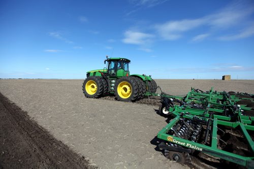 Brandon Sun 16042012 A worker with Keller Farms tills a field southwest of Shilo, Manitoba on a sunny Monday, April 16 afternoon. (Tim Smith/Brandon Sun)