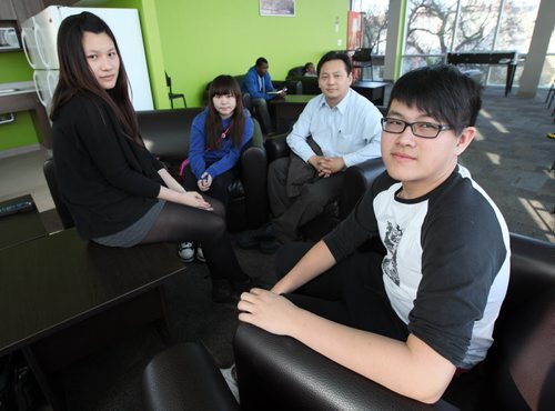 Left to right, foreign students Ching Mon Wan 22, Yan Ting Lai 20, and Herbert Wai Hong 18 sit with Joe Chan (second from right), See Kelly Graham's story.  April 19, 2012 - (Phil Hossack / Winnipeg Free Press)