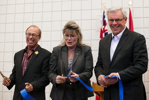 Mayor Sam Katz (left), Shelly Glover, MP for St. Boniface and Premiere Greg Selinger cut the ribbon for the official opening of the newly renovated Winakwa Community Centre opening on Friday.  120420 - Friday, April 20, 2012 -  Melissa Tait / Winnipeg Free Press