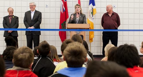 Mayor Sam Katz and Premiere Greg Selinger react to children watching Shelly Glover, MP for St. Boniface, at the official opening of the newly renovated Winakwa Community Centre opening on Friday.  120420 - Friday, April 20, 2012 -  Melissa Tait / Winnipeg Free Press