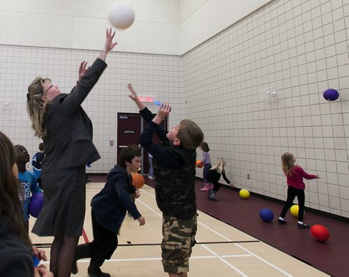 St. Boniface MP Shelly Glover plays basketball with kids in the newly renovated Winakwa Community Centre on Friday.  120420 - Friday, April 20, 2012 -  Melissa Tait / Winnipeg Free Press