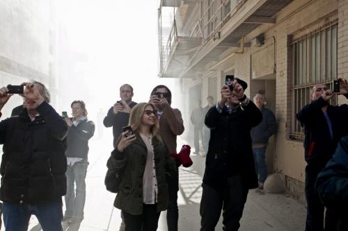 Onlookers are enveloped in smoke as they record the Albert Street fire on Thursday morning in the Exhange District. 120419 - Thursday, April 19, 2012 -  Melissa Tait / Winnipeg Free Press