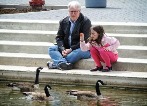 Josh Ramsbottom and his daughter, Morgan, 7, on the steps of the new Family Centre by the Duck Pond at Assiniboine Park Saturday afternoon.  120421 April 21, 2012 Mike Deal / Winnipeg Free Press
