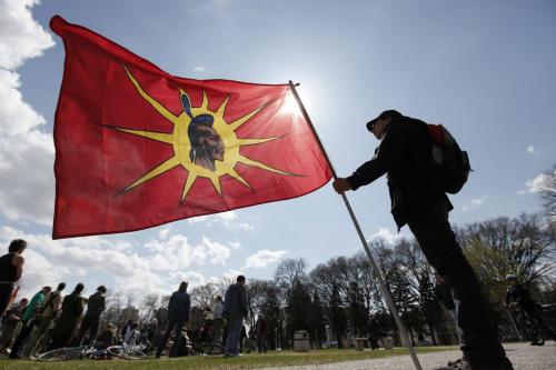 April 22, 2012 - 120422  - The mohawk flag flies as Morris St. Croix and a couple of hundred people participated in an Earth day rally and march at Memorial Park Sunday, April 22, 2012.    John Woods / Winnipeg Free Press