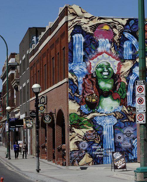 Street scene on Osborne , with old and new buidlings , tattoo shops , resturants , bars, shopping and murals . Osborne Village voted Canada's best neighborhood By the Canadian Instutute of Planners in an e-poll KEN GIGLIOTTI  / WINNIPEG FREE PRESS  / April 26 2012